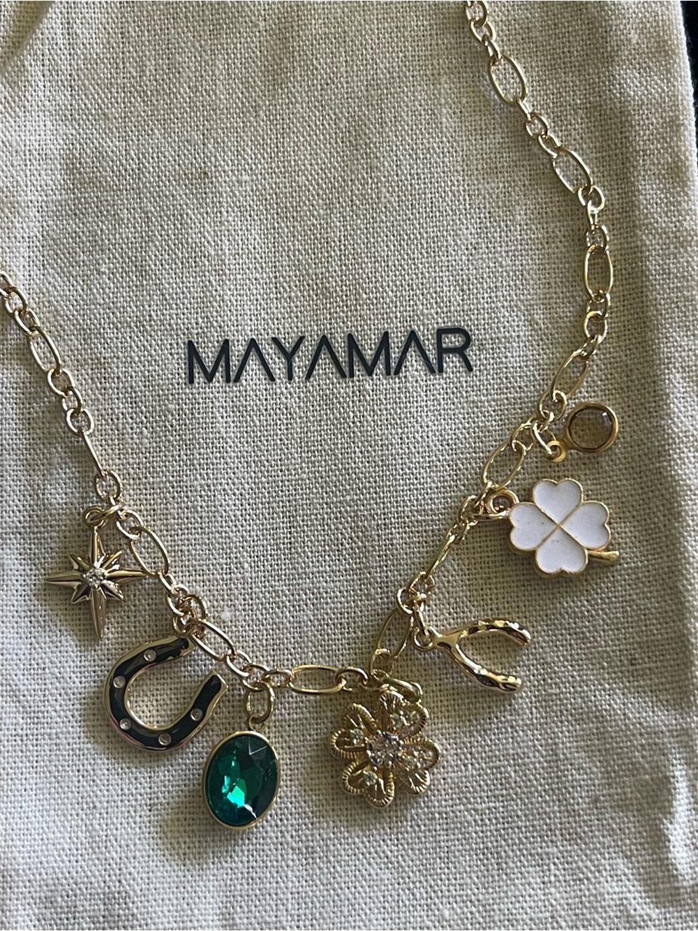Mayamar Gold Charm Necklace with Green Gem & White Clover, wish bone